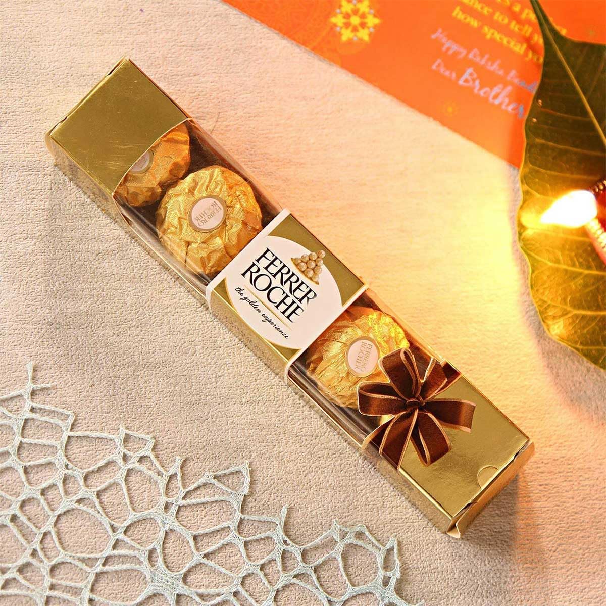 Rakhi Gift Combo for Bhaiya - Ganesh Ji Rakhi with Crystal Lotus Diya, Chocolate Gift Rakhi Gift Combo for Bhaiya - Ganesh Ji Rakhi with Crystal Lotus Diya, Chocolate Gift